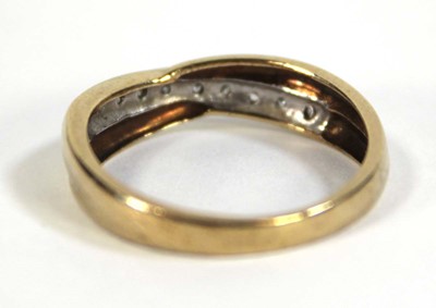 Lot 605 - A 9ct yellow gold ring set small diamonds in a...