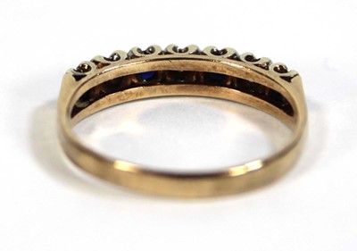 Lot 606 - A 9ct yellow gold half eternity ring set small...