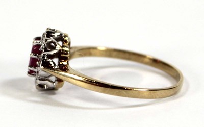 Lot 607 - A 9ct yellow gold cluster ring set oval ruby...