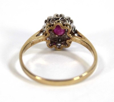 Lot 607 - A 9ct yellow gold cluster ring set oval ruby...