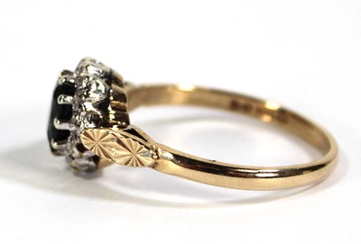 Lot 610 - A 9ct yellow gold cluster ring set oval...
