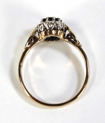 Lot 610 - A 9ct yellow gold cluster ring set oval...