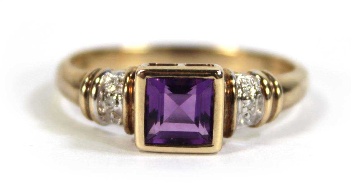 Lot 611 - A 9ct yellow gold ring set square cut amethyst...