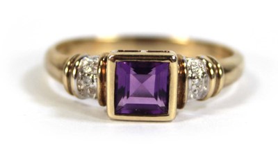 Lot 611 - A 9ct yellow gold ring set square cut amethyst...
