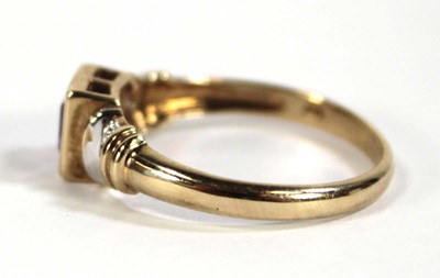 Lot 611 - A 9ct yellow gold ring set square cut amethyst...