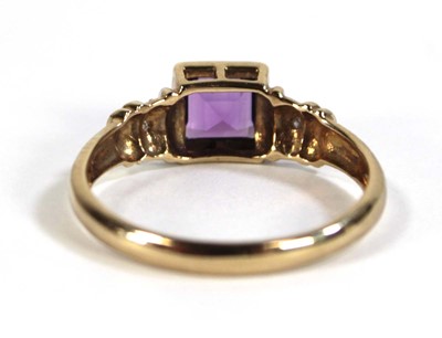 Lot 611 - A 9ct yellow gold ring set square cut amethyst...