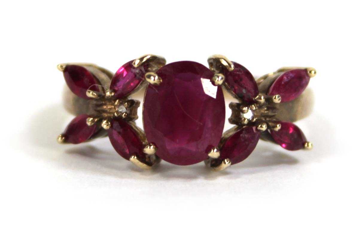 Lot 612 - A 9ct yellow gold ring set oval and marquise...