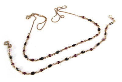 Lot 613 - A 9ct yellow gold necklace set nine small...