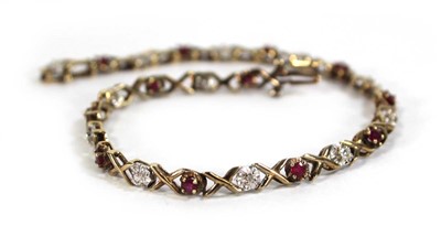 Lot 614 - A 9ct yellow gold tennis bracelet set small...