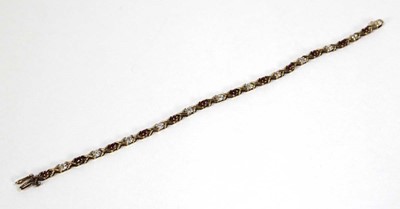 Lot 614 - A 9ct yellow gold tennis bracelet set small...