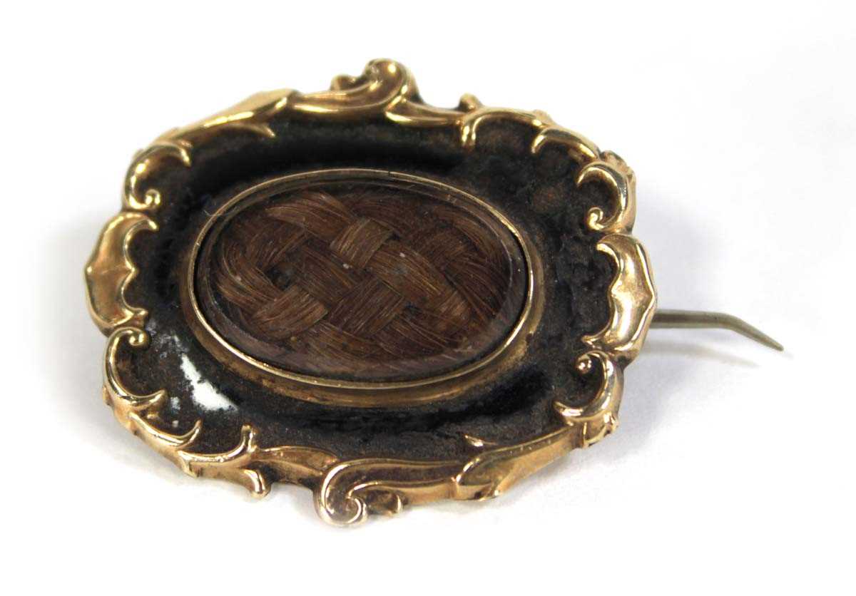 Lot 621 - A 19th century yellow metal mourning brooch of...