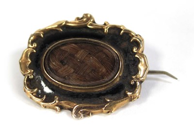 Lot 621 - A 19th century yellow metal mourning brooch of...