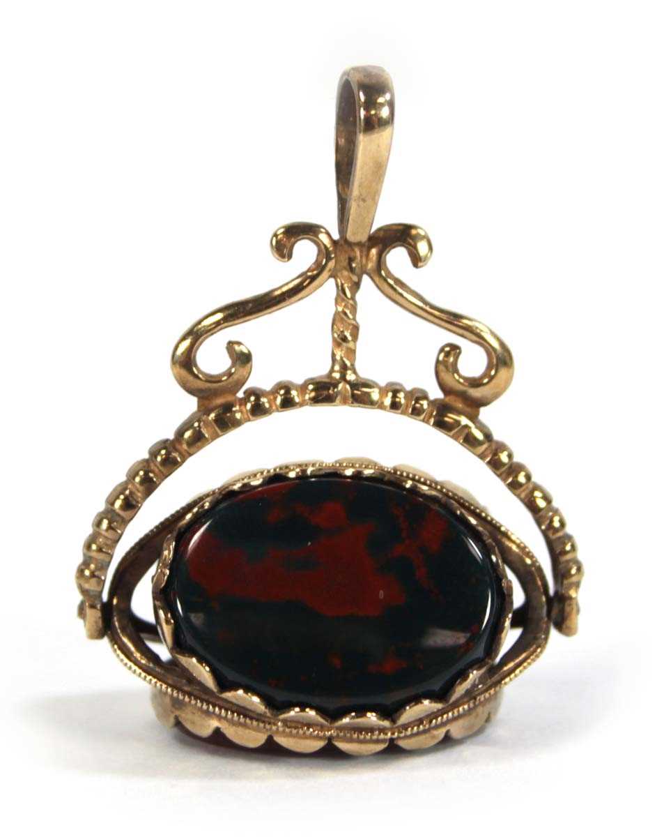 Lot 622 - A 9ct yellow gold swivel fob set hardstone, l....