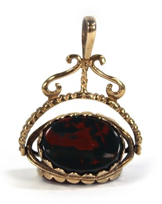 Lot 622 - A 9ct yellow gold swivel fob set hardstone, l....