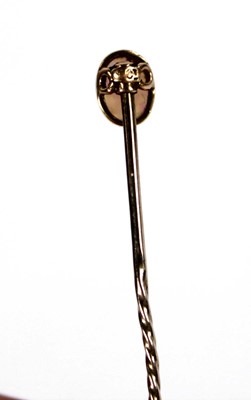 Lot 624 - A 15ct yellow gold stick pin set opal within a...