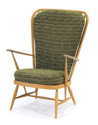 Lot 174 - An Ercol beech spindle high-back armchair on...