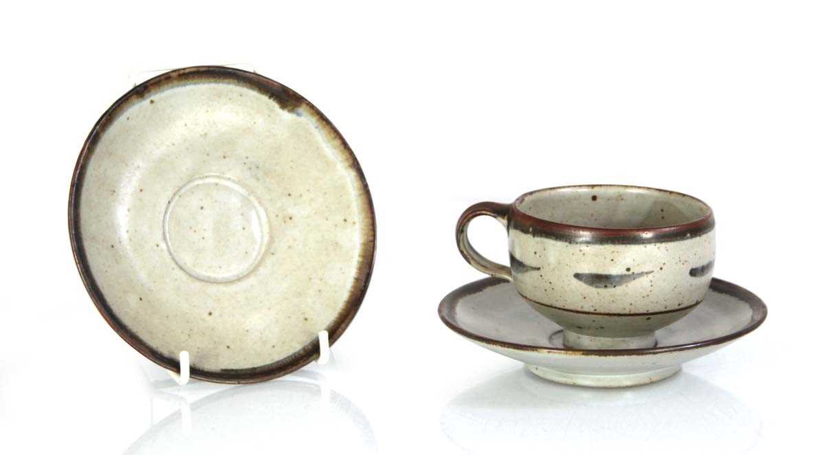 Lot 101 - A Lowerdown Pottery cup and saucer decorated...