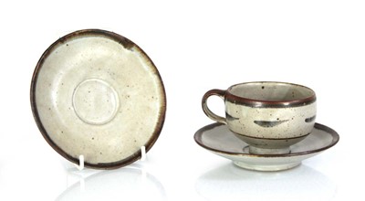 Lot 101 - A Lowerdown Pottery cup and saucer decorated...