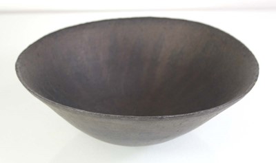 Lot 217 - (C) John Ward (1938-2023), a black glazed...