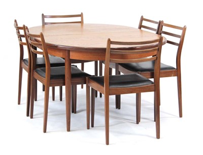 Lot 232 - A G-Plan teak and crossbanded extending dining...