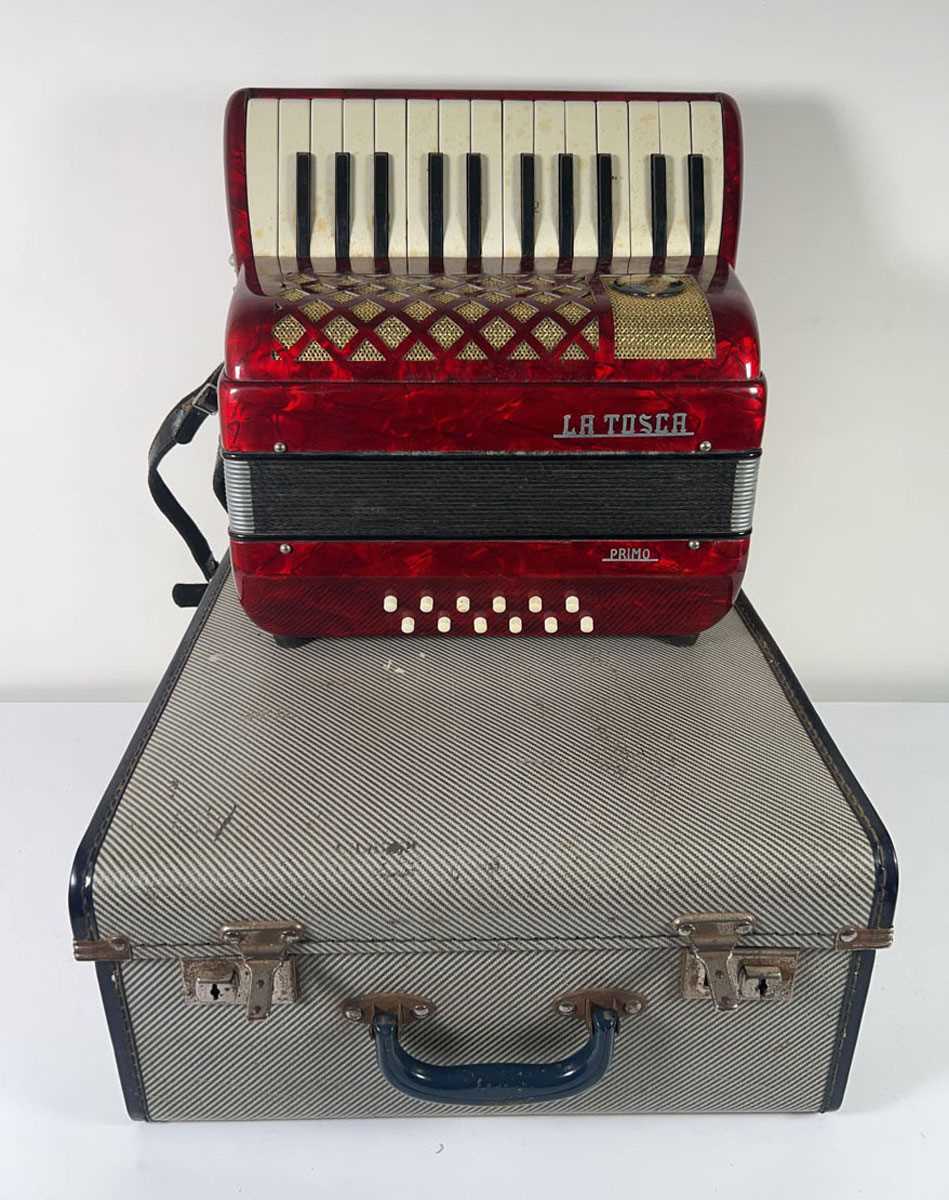 Lot A La Tosca 'Primo' 25 key 12 button piano...