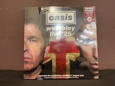 Lot A sealed three LP box set, Oasis - Wembley...