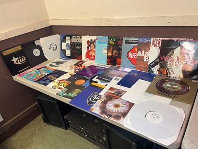 Lot A box containing an assortment of vinyl...
