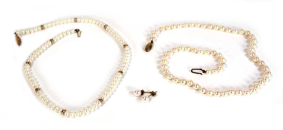 Lot 626 - Two single strand cultured pearl necklaces,...