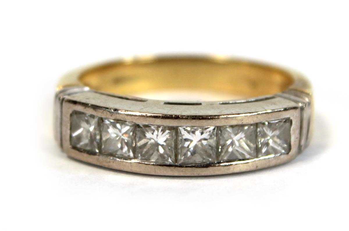 Lot 628 - An 18ct yellow gold half eternity ring set six...