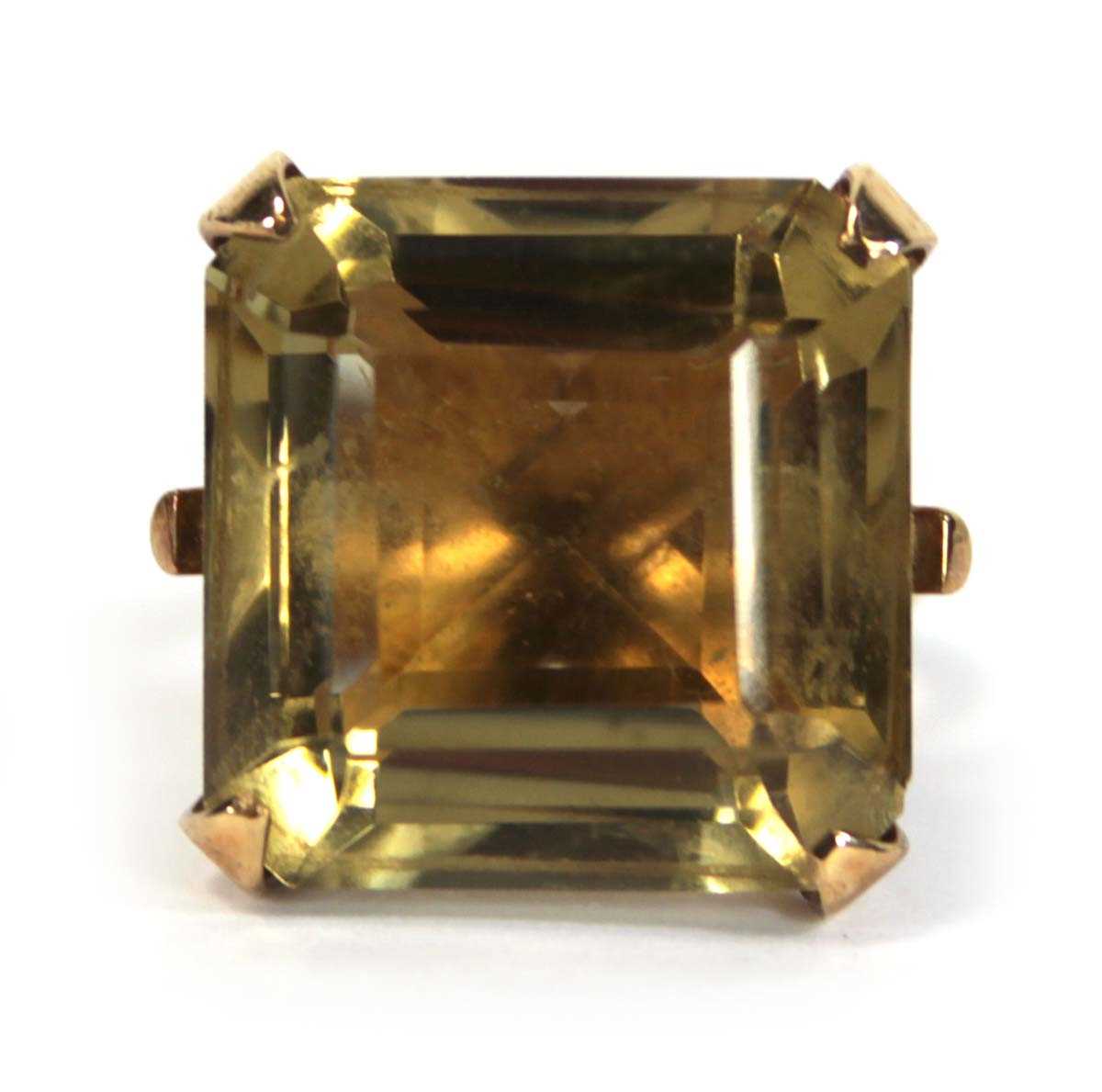 Lot 630 - A 9ct yellow gold dress ring set square cut...