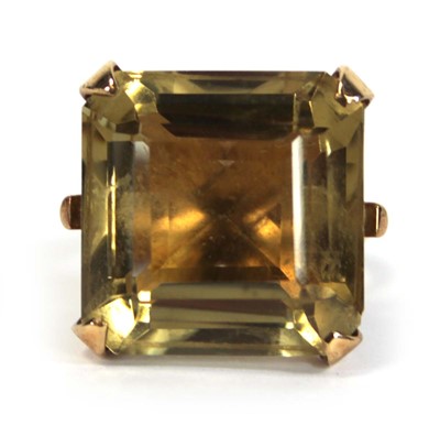 Lot 630 - A 9ct yellow gold dress ring set square cut...