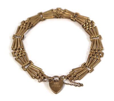 Lot 636 - A 9ct yellow gold four bar gatelink bracelet...