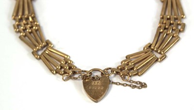 Lot 636 - A 9ct yellow gold four bar gatelink bracelet...