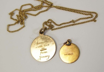 Lot 637 - A 9ct yellow gold St Christopher pendant on a...