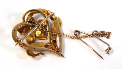 Lot 638 - A 15ct yellow gold openwork brooch of heart...