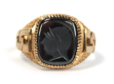 Lot 647 - A 9ct yellow gold signet ring set hematite...