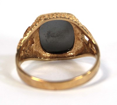 Lot 647 - A 9ct yellow gold signet ring set hematite...