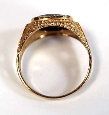 Lot 647 - A 9ct yellow gold signet ring set hematite...