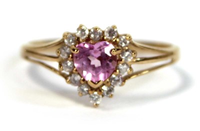 Lot 648 - A 9ct yellow gold ring set heart shaped pale...