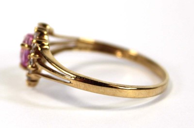 Lot 648 - A 9ct yellow gold ring set heart shaped pale...