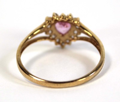 Lot 648 - A 9ct yellow gold ring set heart shaped pale...