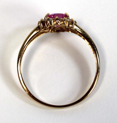 Lot 648 - A 9ct yellow gold ring set heart shaped pale...