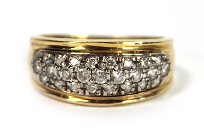 Lot 652 - A yellow metal ring set small white stones in...