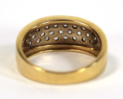 Lot 652 - A yellow metal ring set small white stones in...