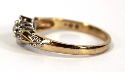 Lot 653 - A 9ct yellow gold ring set small diamonds in...