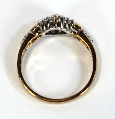 Lot 653 - A 9ct yellow gold ring set small diamonds in...