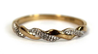 Lot 654 - A 9ct two colour gold twist type band ring set...