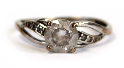 Lot 656 - A 9ct white gold ring set white stone in a...
