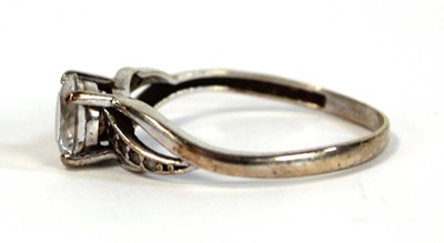 Lot 656 - A 9ct white gold ring set white stone in a...