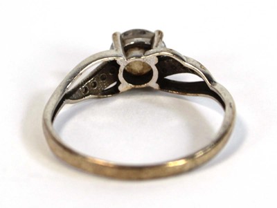 Lot 656 - A 9ct white gold ring set white stone in a...